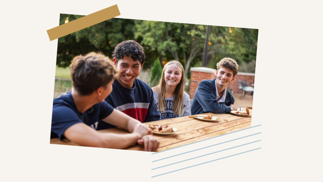 Photo of students sitting at a table.